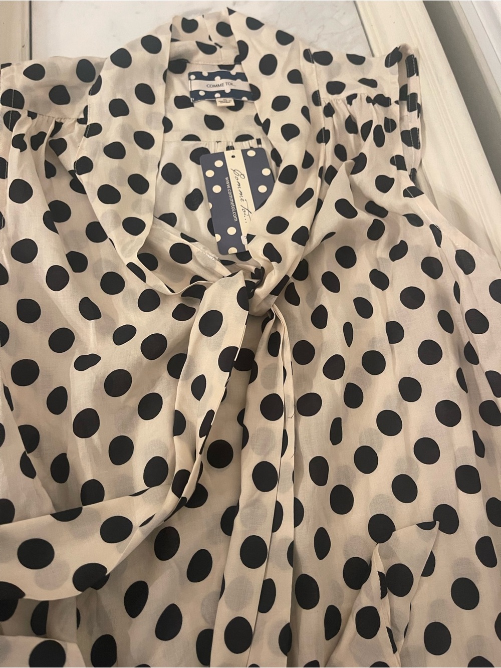 Sleeveless Polka Dot Tie-Neck Blouse in Cream and Black - Picture 2 of 4